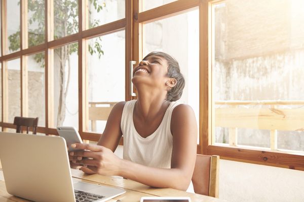 portrait-young-brunette-woman-sitting-cafe-with-laptop